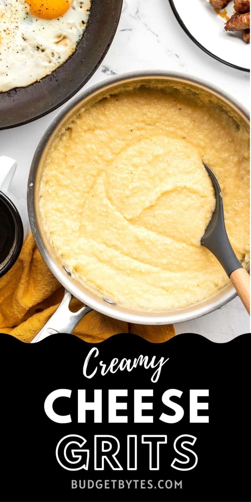 Cheese grits in a sauce pot with spoon, title text at the bottom