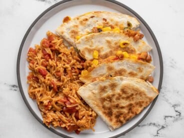 Plated quesadillas and Spanish rice.
